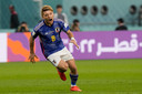 Ritsu Doan schreeuwt het uit na zijn goal voor Japan, tegen Duitsland.