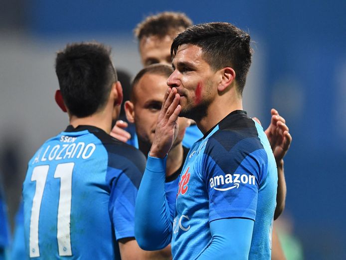 The red stripes on Napoli's faces are part of an annual campaign in Italy against domestic violence.