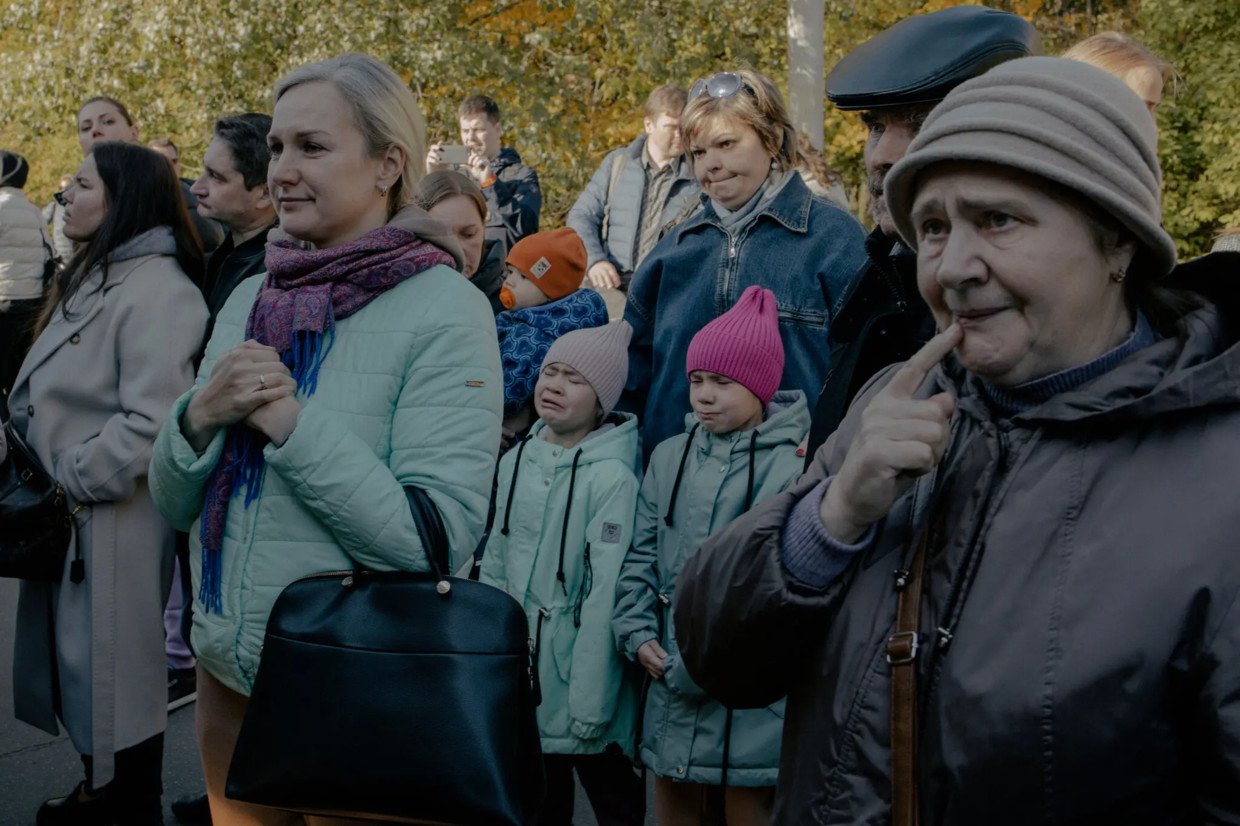 Relatives say goodbye at the employment office in Moscow.  New York Times photo