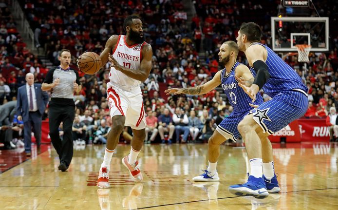 HOUSTON, TX - JANUARY 27:  James Harden #13 of the Houston Rockets dribbles the ball defended by Evan Fournier #10 of the Orlando Magic and Nikola Vucevic #9 in the first half at Toyota Center on January 27, 2019 in Houston, Texas.  NOTE TO USER: User expressly acknowledges and agrees that, by downloading and or using this photograph, User is consenting to the terms and conditions of the Getty Images License Agreement.  (Photo by Tim Warner/Getty Images)