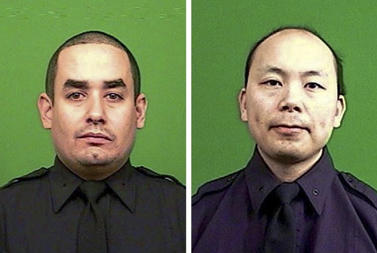 De omgekomen agenten Rafael Ramos en Wenjian Liu. Beeld EPA