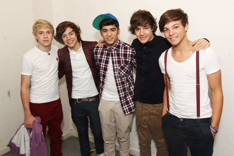 Vanaf links:  Niall Horan, Harry Styles, Zayn Malik, Liam Payne en Louis Tomlinson  van One Direction in 2011. Beeld Dave Hogan/Getty Images