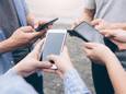 Group of young teen using mobile phones. Teenagers using mobile to chatting.