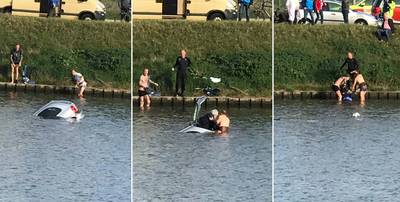 Oplettende omstanders bevrijden hoogbejaarde bestuurder uit zinkende auto