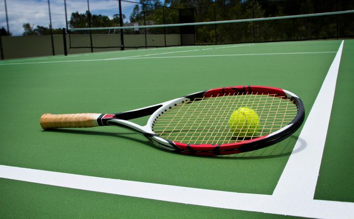 Tennis Racket and Ball on court