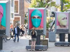 Kleurrijke portretten geven mensenhandel een gezicht in hartje Veenendaal