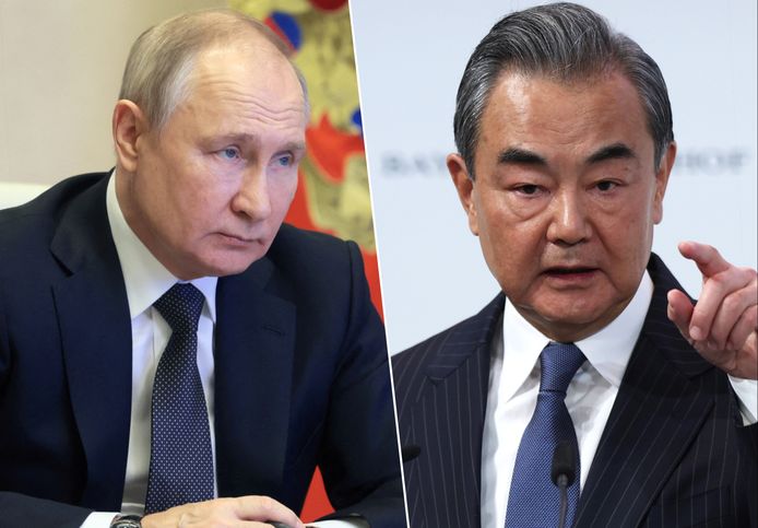 De Russische president Vladimir Poetin (links) en de Chinese topdiplomaat Wang Yi (rechts).