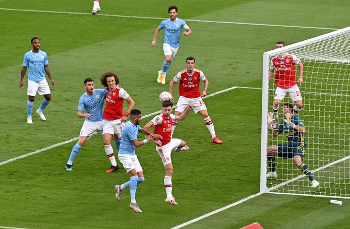 Players compete for the ball during the FA Cup semifinal soccer match between Arsenal and Manchester City at Wembley in London, England, Saturday, July 18, 2020. (AP Photo/Justin Tallis,Pool)