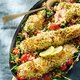 Krokante zalm met spinazie en tomaatjes