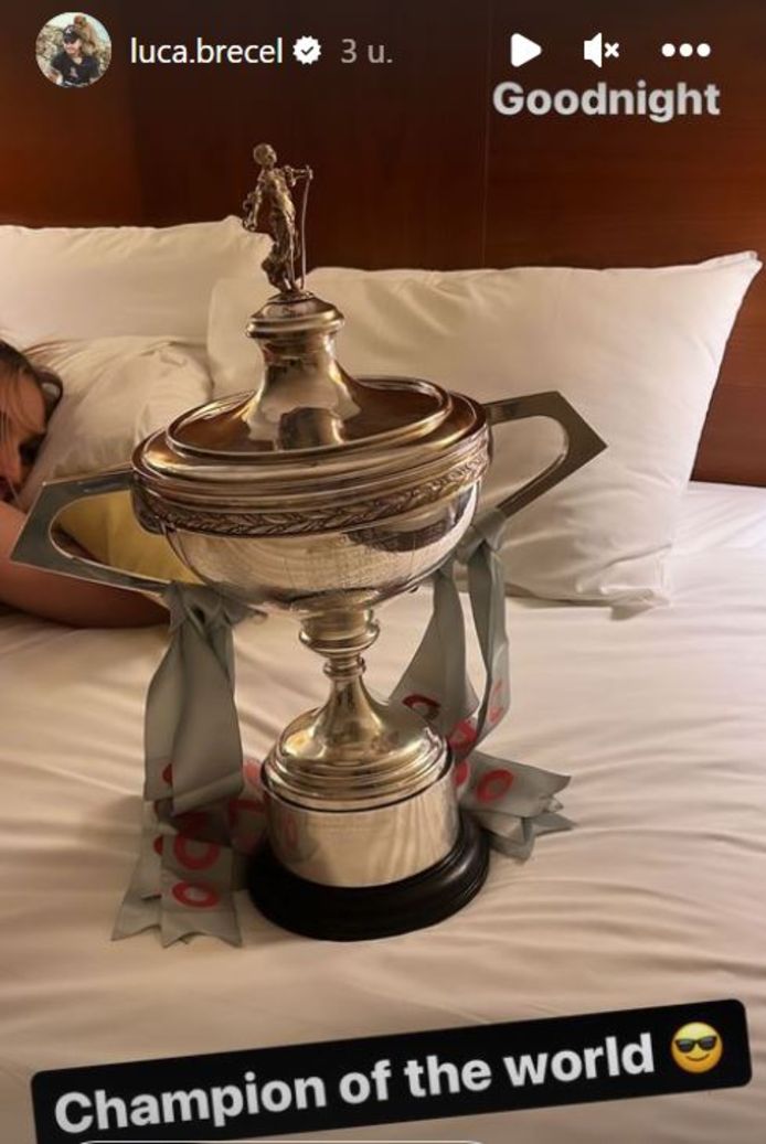 Precel crawled under the sheets holding the World Cup.