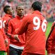 Suarez en Evra schudden eindelijk handen