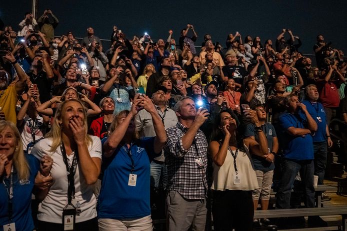 In this photo provided by NASA, guests at the Banana Creek watch the launch of NASA's Space Launch System rocket carrying the Orion spacecraft on the Artemis I flight test, Tuesday, Nov. 15, 2022, at NASA's Kennedy Space Center in Fla. (Keegan Barber/NASA via AP)