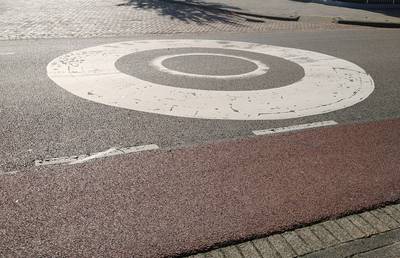 What are these mysterious circles on the street?
