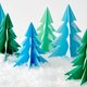 Deze vrolijke origami kerstbomen maak je gewoon zelf