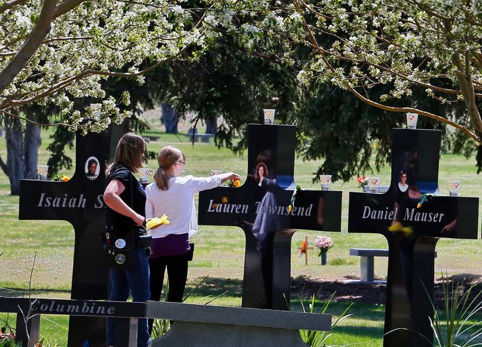 Family visits the graves of Columbine High School victims.