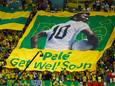 Soccer Football - FIFA World Cup Qatar 2022 - Group G - Cameroon v Brazil - Lusail Stadium, Lusail, Qatar - December 2, 2022 Brazil fans display a banner with an image of former player Pele on it before the match REUTERS/Peter Cziborra