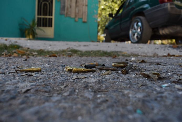 Spent bullet casings lay on the street after a gun battle between Mexican security forces and suspected cartel gunmen, in Villa Union, Mexico, Sunday, Dic. 1, 2019. Mexican security forces on Sunday killed seven more members of a presumed cartel assault force rolled into a town near the Texas border and staged an hour-long attack, officials said, bringing the death toll to at least 21. (AP Photo/Gerardo Sanchez)