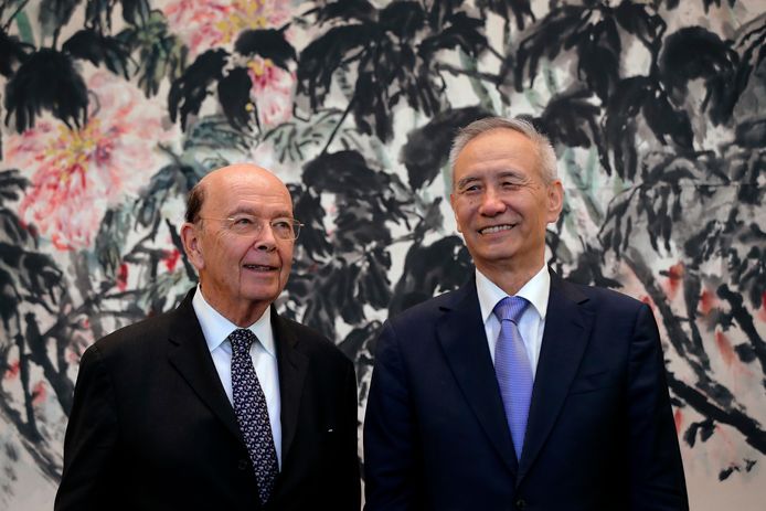 Amerikaans minister van Handel Wilbur Ross (links) en Chinese vicepremier Liu He tijdens hun laatste gesprekken in juni.