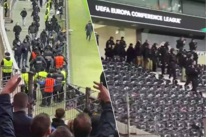 De Duitse politie (rechts) grijpt op tijd in wanneer Frankfurt-fans richting het bezoekende vak stappen.