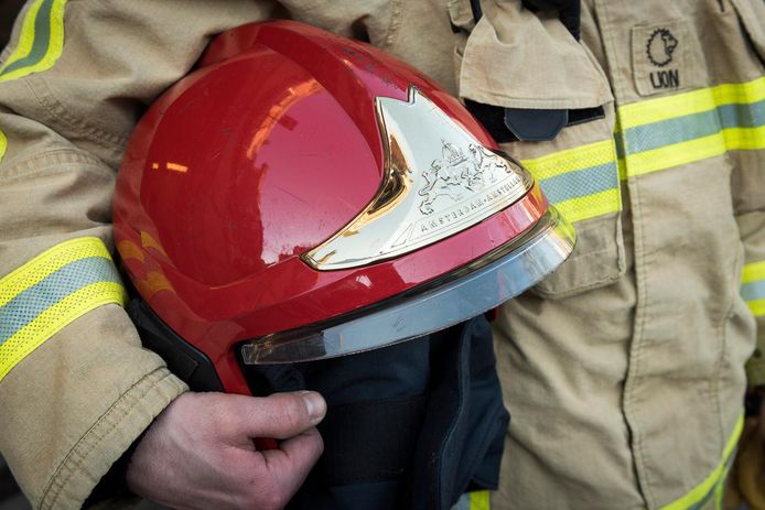 2017-01-19 15:00:43 AMSTERDAM - Kleding en een helm van een brandweerman. ANP XTRA LEX VAN LIESHOUT