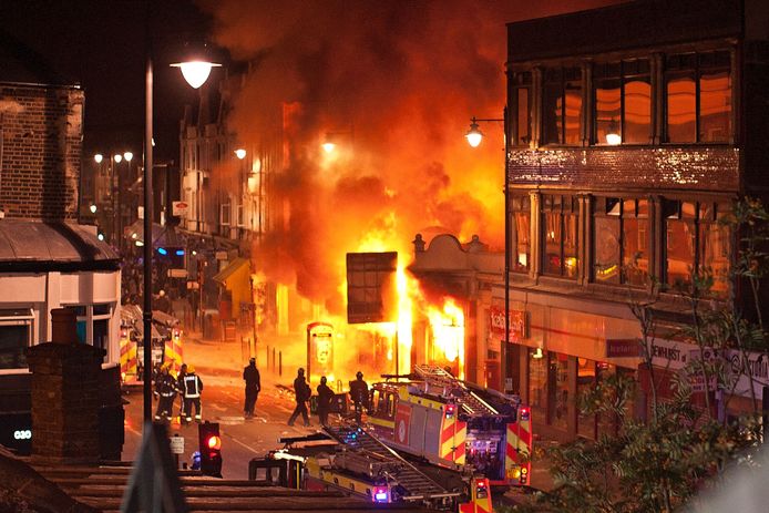 Burning buildings on Tottenham High Road, London, in August 2011. The riots started after Mark Duggan was shot dead two days earlier.