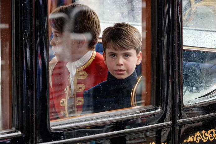 Prince Louis in a carriage from Westminster Abbey to Buckingham Palace.