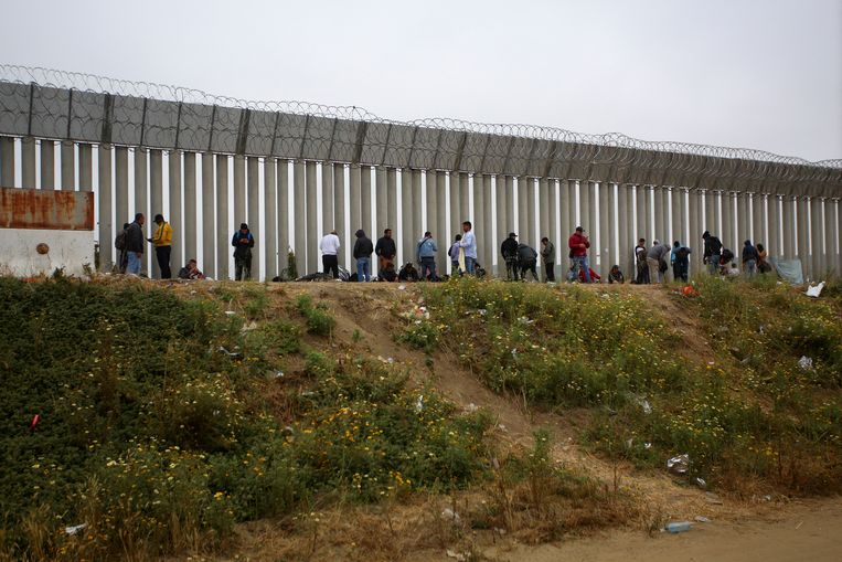 Settlers at the border wall in San Ysidro, California.  Image courtesy REUTERS