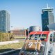 Tussen de hijskranen van de flitsende nieuwbouw op Overhoeks in Amsterdam-Noord schemert een roerig verleden