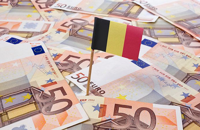 Flag of Belgium sticking in european bank notes.