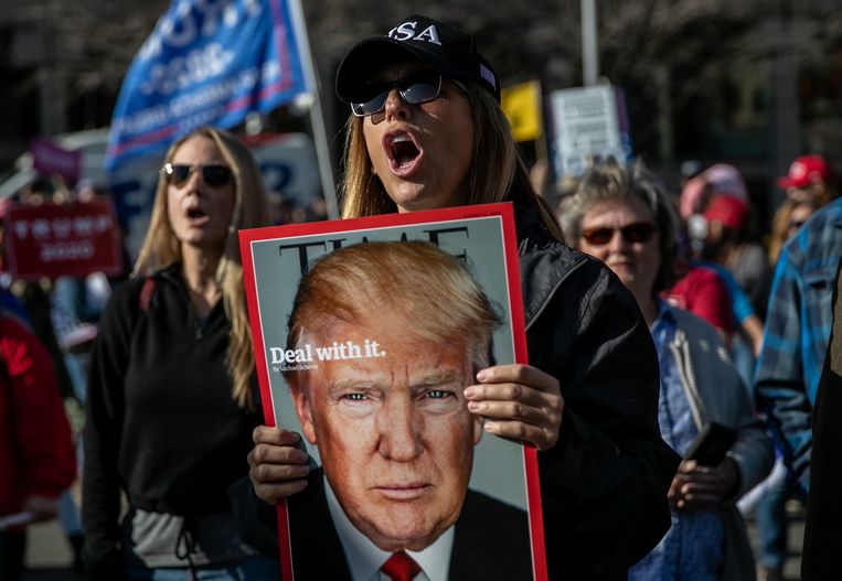 Trump-supporters bij een demonstratie op 6 november in Detroit.  Beeld Getty Images