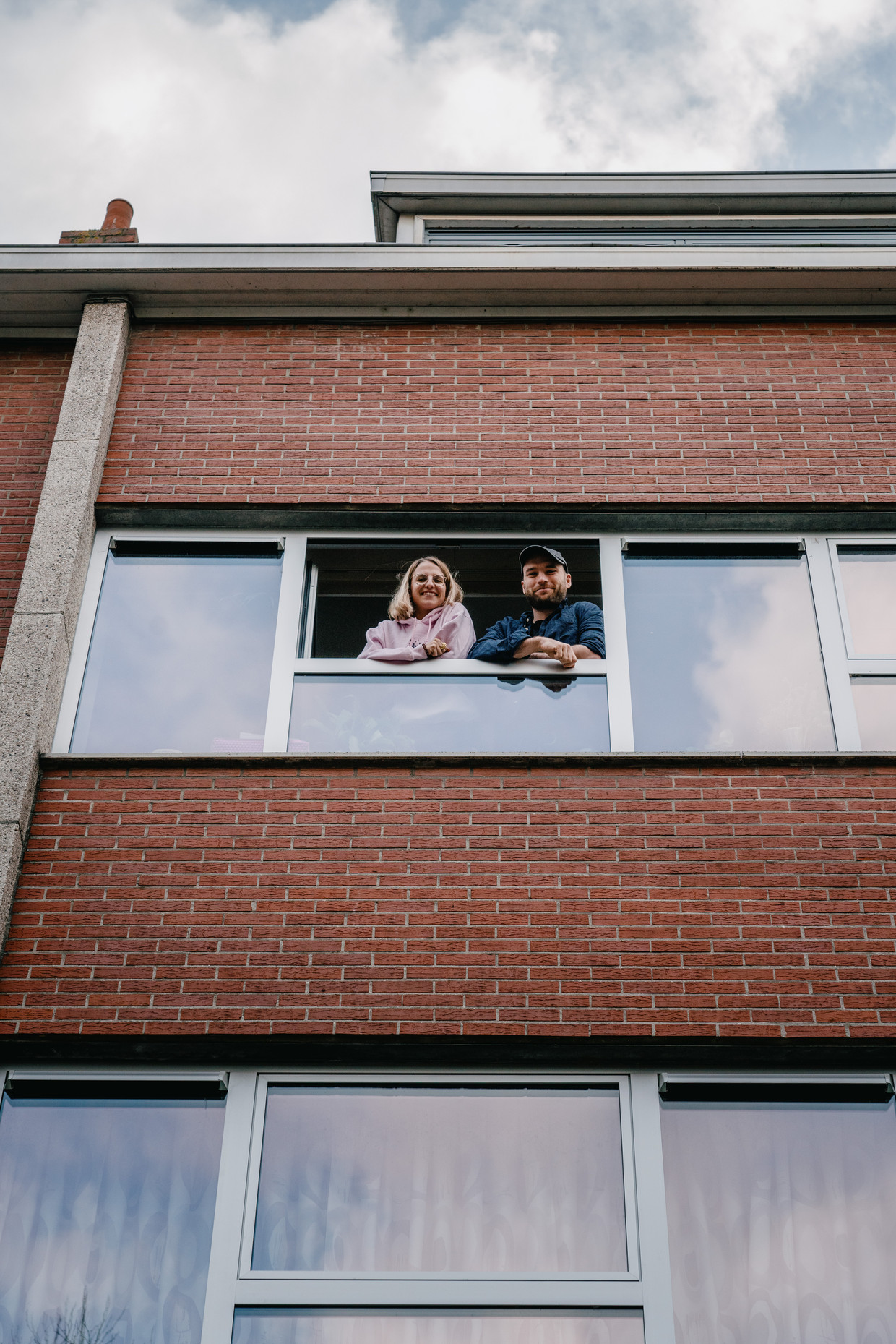 Jan and her boyfriend in their apartment in Ghent.  