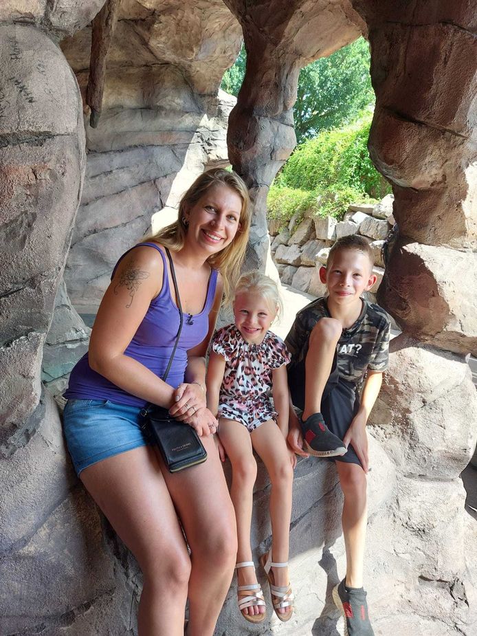 Ilona enjoys a day at the amusement park with her son and daughter.