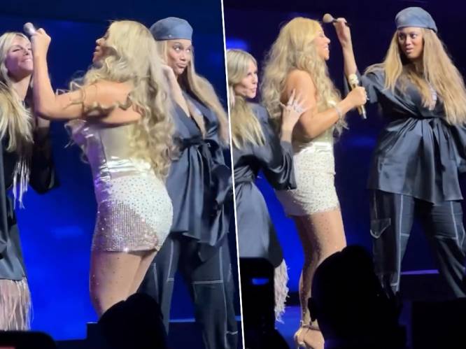 KIJK. Topmodellen en beste vriendinnen Heidi Klum en Tyra Banks verrassen Mariah Carey op het podium