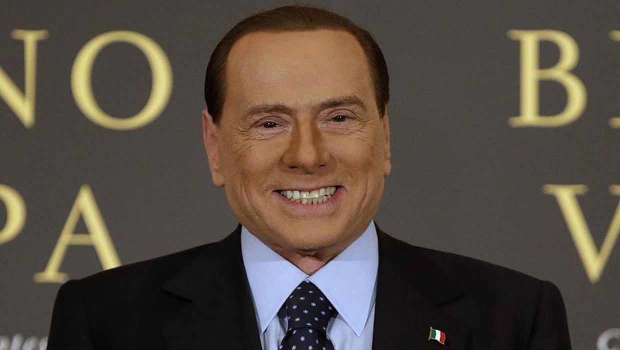 Silvio Berlusconi tijdens een boekpresentatie. Beeld reuters