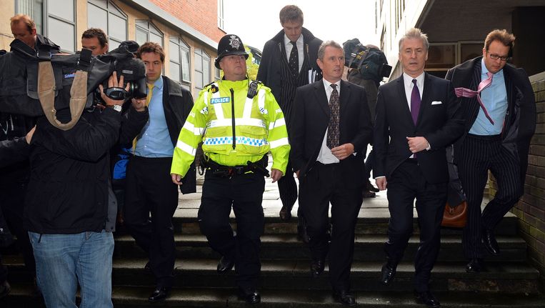 Onder-voorzitter van het parlement Nigel Evans, derde van rechts, stond vorig jaar terecht wegens verkrachting. Beeld AFP