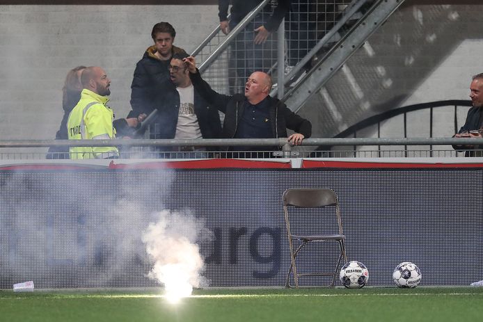 The match is stopped after forty minutes, partly because of the fireworks that land on the field.