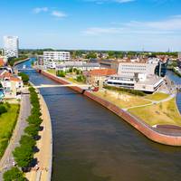 ‘Een gecentraliseerde installatie is goedkoper dan afzonderlijke warmtepompen’: waarom Kortrijk kiest voor aquathermie