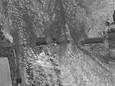 Maxar-satellietfoto van de damdoorbraak.