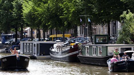 Woonboten in de Herengracht in Amsterdam. Foto ANP