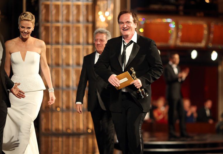 Quentin Tarantino (R) en Charlize Theron (L). Beeld getty