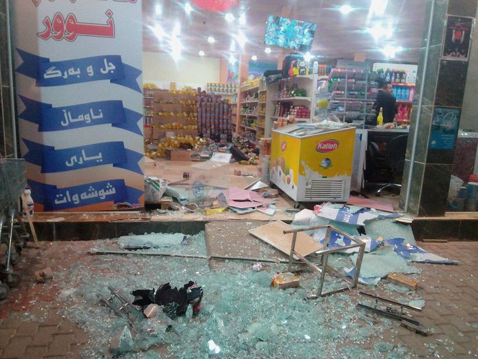 Een beschadigde winkel in Halabja in Irak.