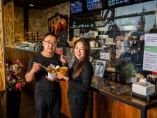 De neonletters doen denken aan restaurants in Hongkong, waar je een ontbijtje varkenshersens haalt
