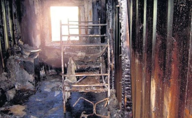 Een door brand verwoeste cel in het detentiecentrum. Beeld anp