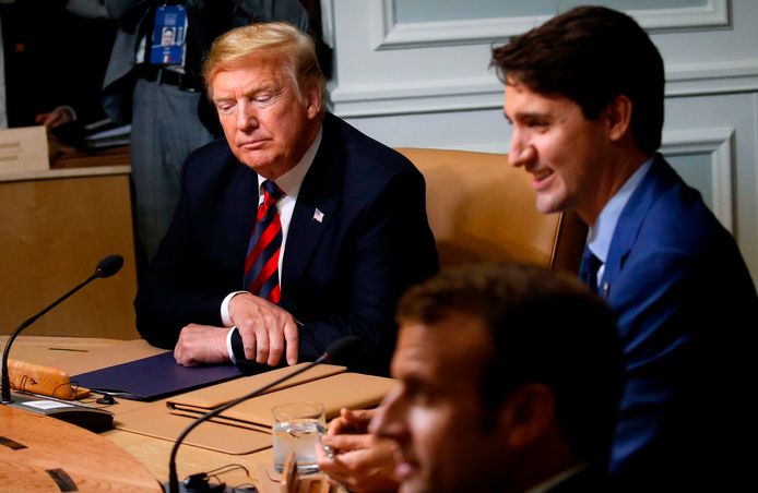 De Amerikaanse president Donald Trump, de Canadese premier Justin Trudeau en de Franse president Emmanuel Macron tijdens de G7-top in Canada.
