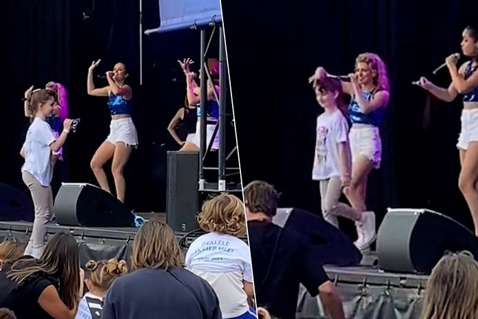 Kleine fan springt op podium tijdens k3-optreden