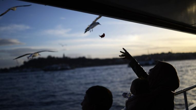 Syrische vluchtelingen op de Bosporus in Turkije Beeld EPA