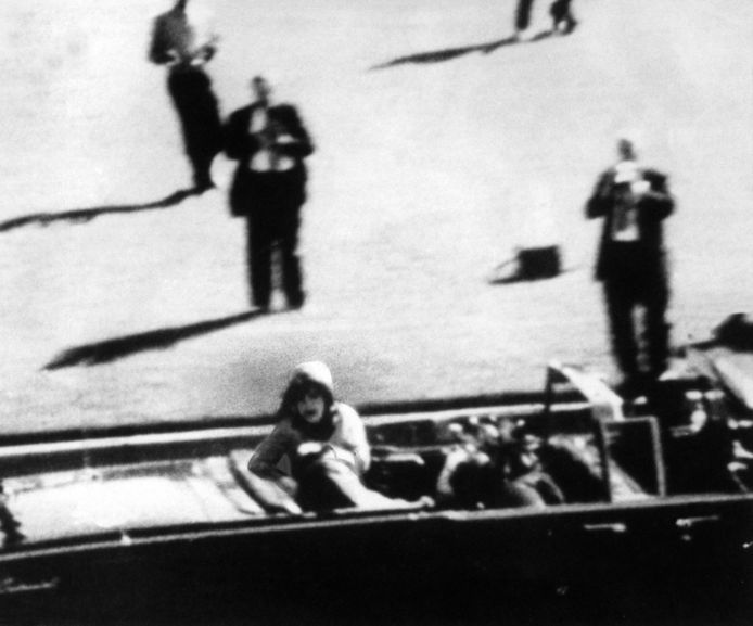 President John F. Kennedy fell  Kennedy on his wife Jackie.  He was fatally shot.