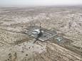 Dronefoto boven de plek waar China een put van minstens 10.000 meter diep wil boren, in regio Xinjiang.