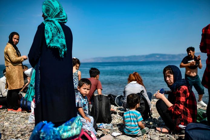 Migranten op het Griekse eiland Lesbos nadat ze de Egeïsche Zee vanuit Turkije overstaken.