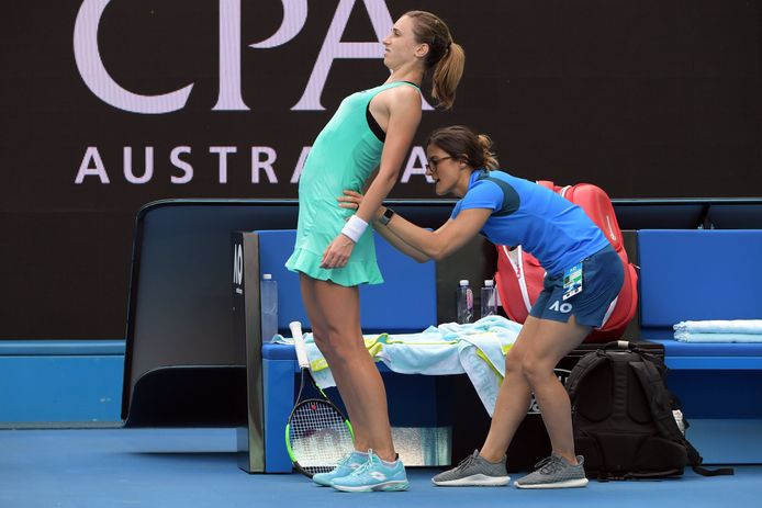 epa06459815 Petra Martic (L) of Croatia receives a message durins a break while in action against Elise Mertens of Belgium during their fourth round match on day seven of the Australian Open tennis tournament, in Melbourne, Victoria, Australia, 21 January 2018.  EPA/TRACEY NEARMY AUSTRALIA AND NEW ZEALAND OUT
